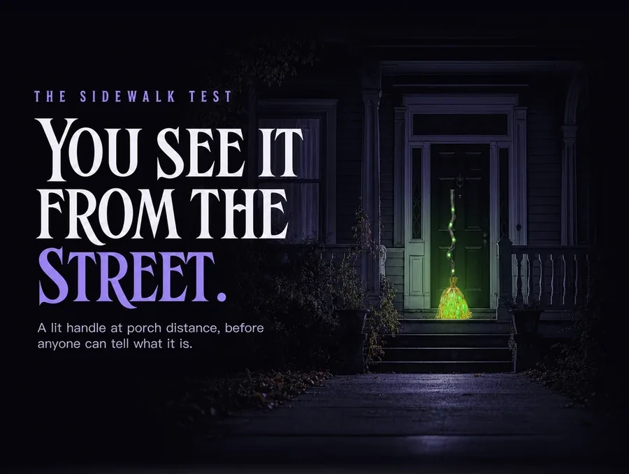 Seen small from the public sidewalk at night, its green light the only thing lit on the porch