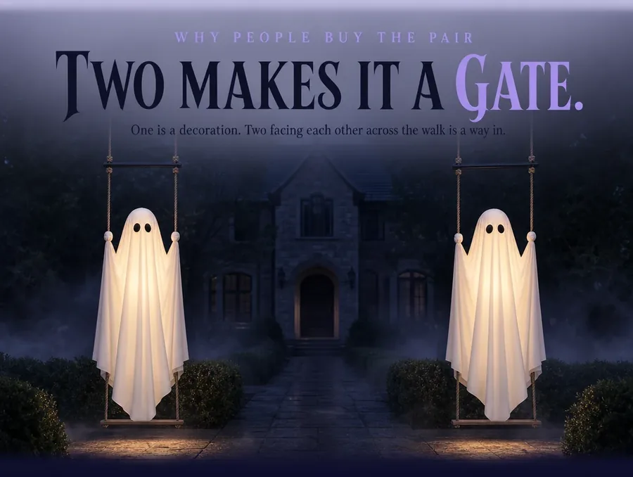 Two identical lit ghosts on their swings, one each side of a front walk, framing the path