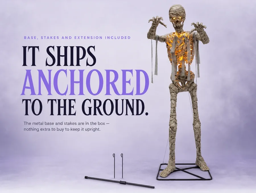 Studio crop of the mummy's wrapped feet on its metal floor base with ground stakes beside it.