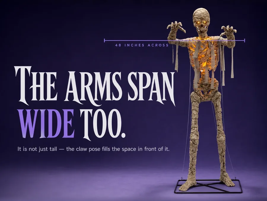 The mummy with arms spread in the claw pose, thin measurement lines marking the span between its hands.