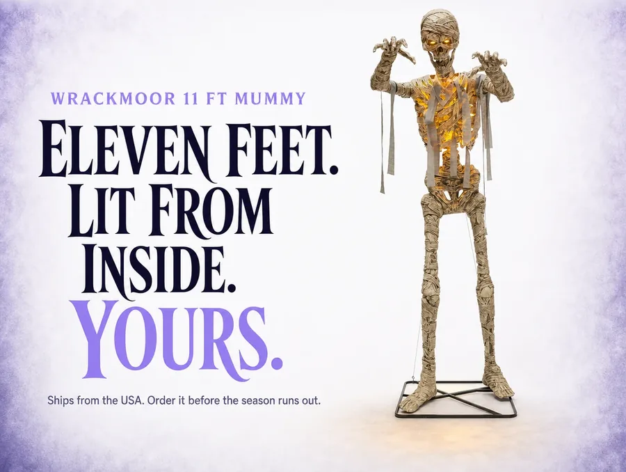 The mummy standing centred on a clean pale background, arms raised, ready to order.
